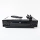 Vintage Pioneer DVD player with remote control and manual DV414